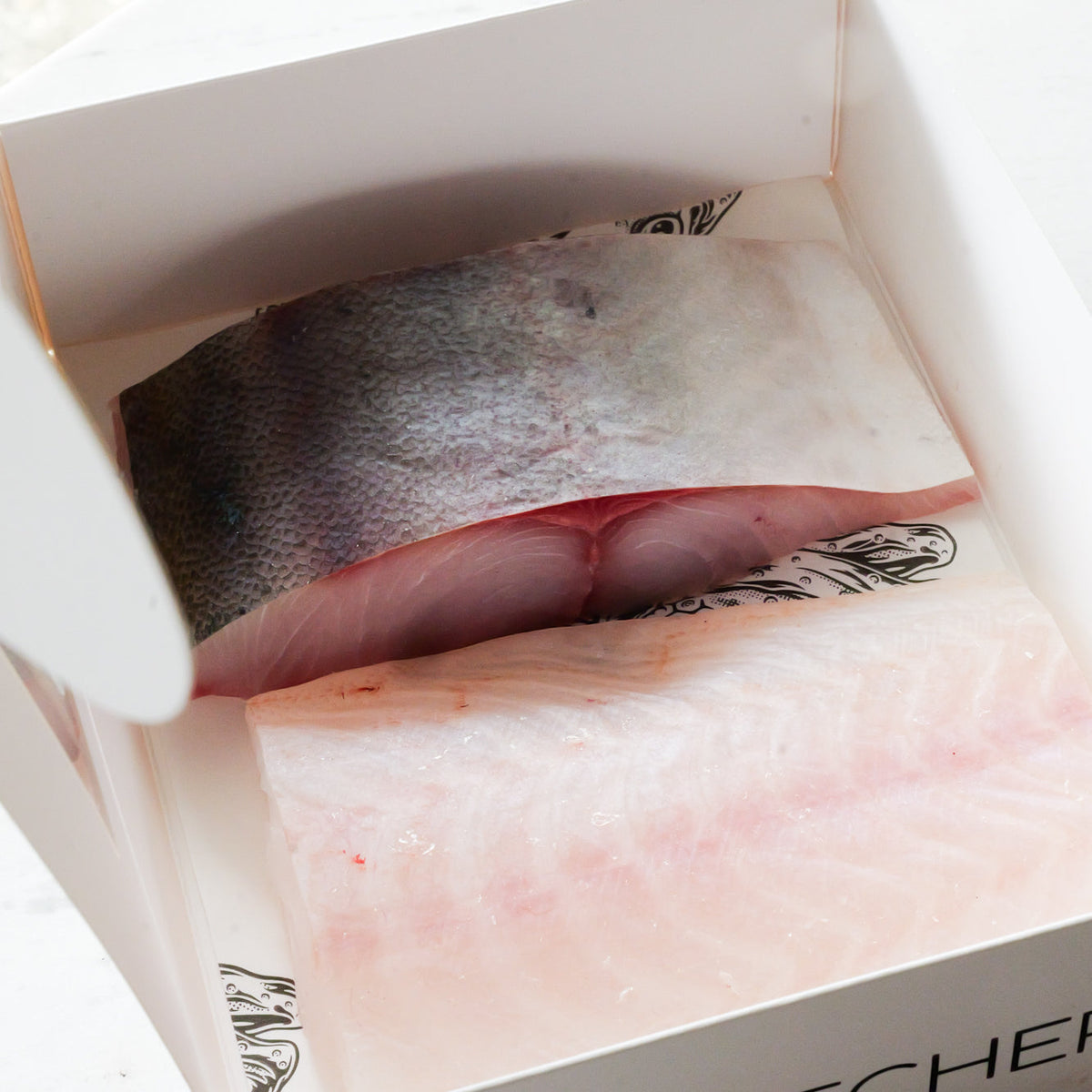 Two fish fillets in a Fish Butchery box